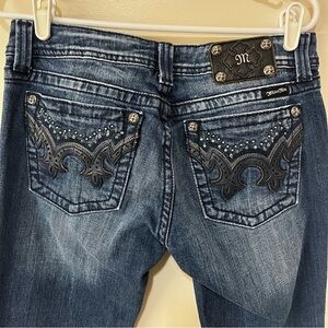 Miss Me Dark Blue Boot Cut Jeans with rhinestone embellishment.